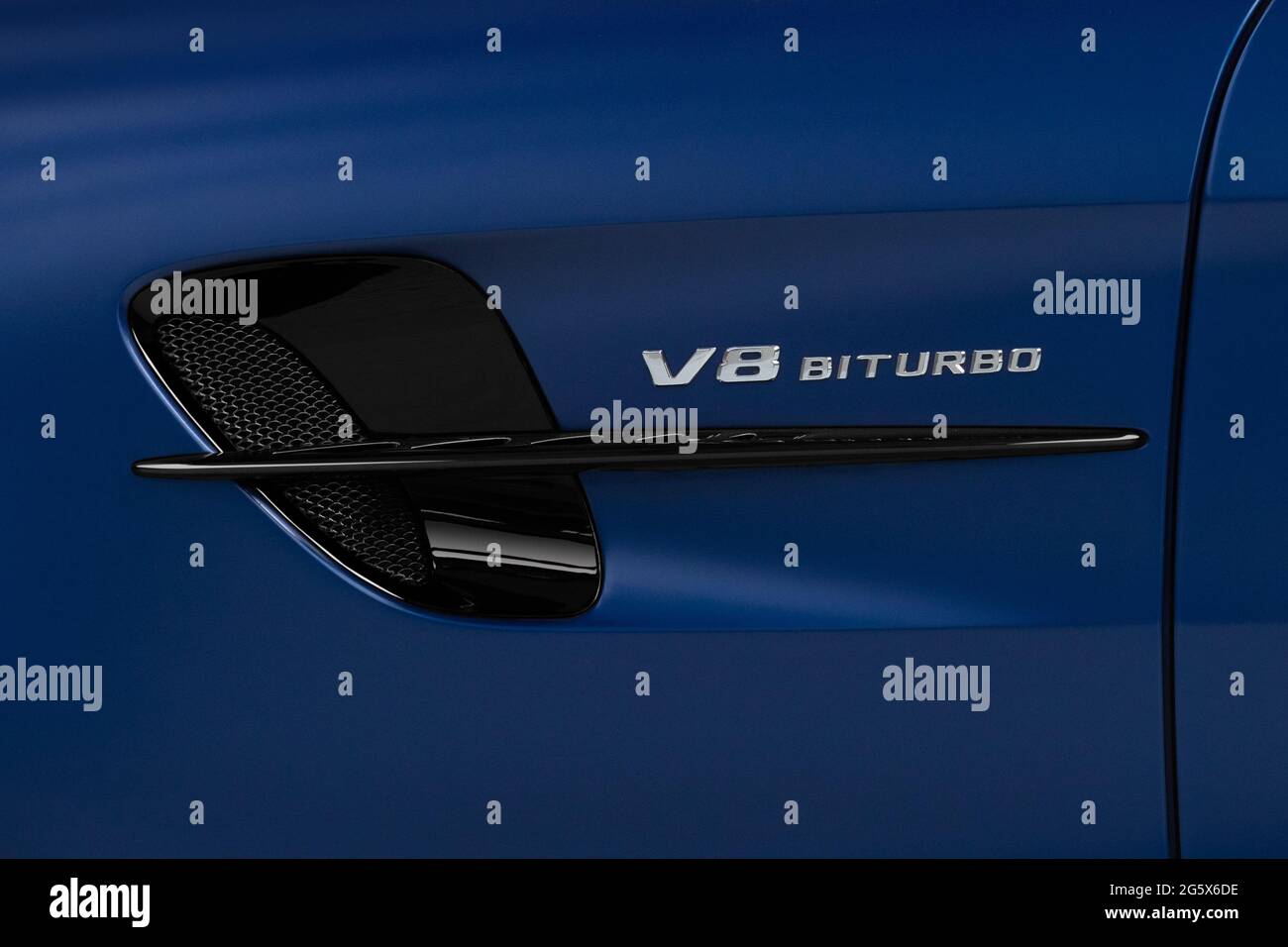 Detail of side air vent and V8 Biturbo badge on a blue 2021 Mercedes AMG GTR V8 Biturbo - Stock Image