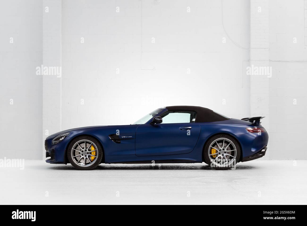 Side view of a blue 2021 Mercedes AMG GTR V8 Biturbo with the hood up - Stock Image