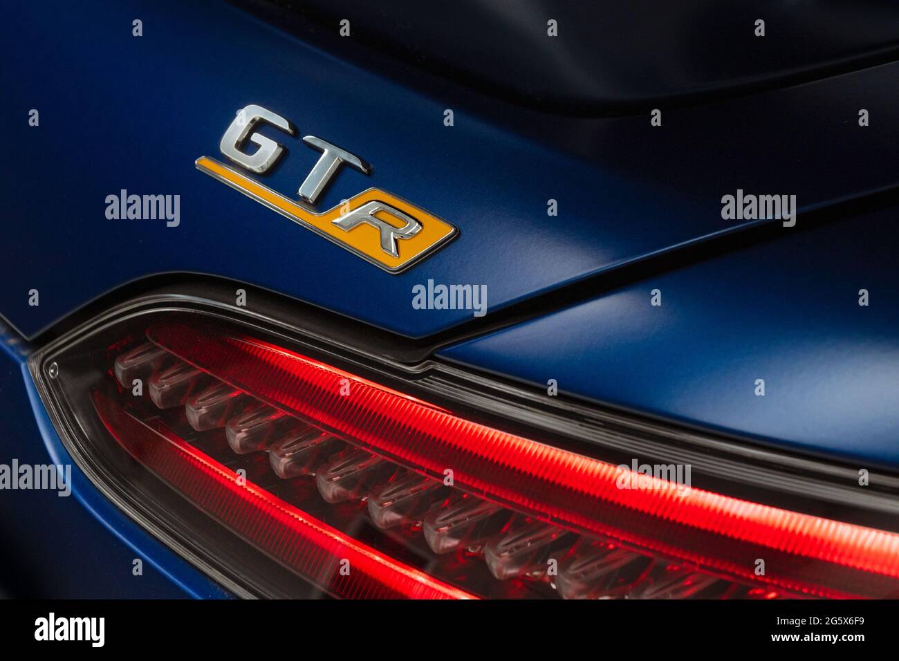 Detail showing GTR name badge and red tail-light on Blue 2021 Mercedes AMG GTR V8 Biturbo - Stock Image