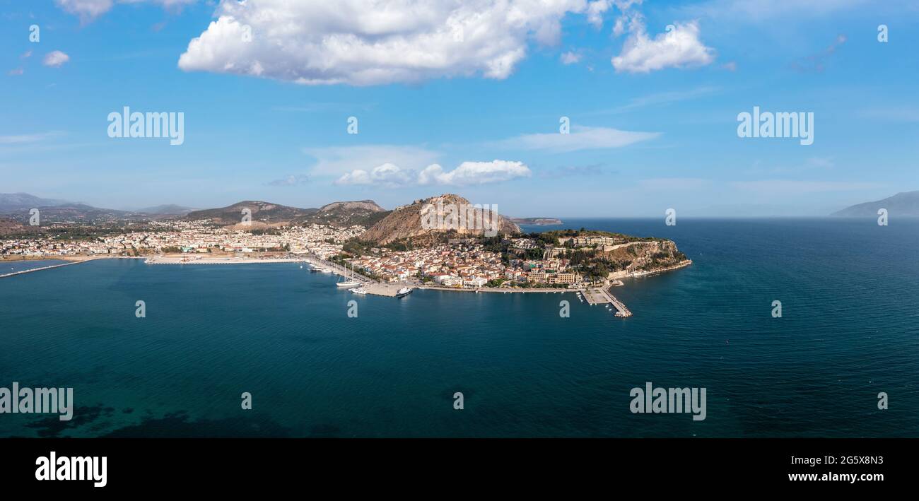 Nafplio or Nafplion city, Greece, Aerial drone panoramic view. Peloponnese old town cityscape, Palamidi castle uphill, yachts and boats moored at the Stock Photo
