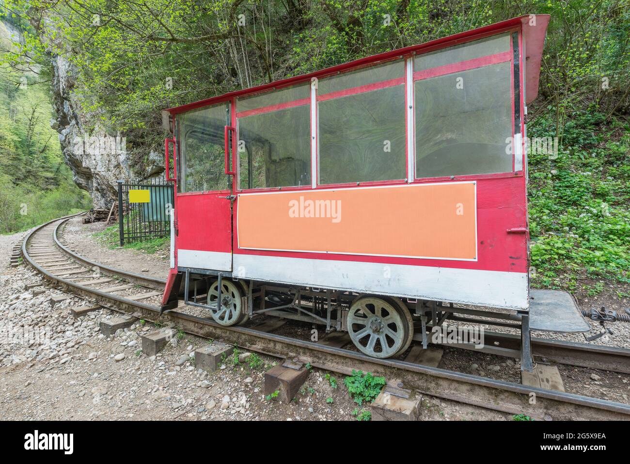 Railcar for the track workers in the deep narrow Guam canyon. Western Caucasus. Russia. Stock Photo