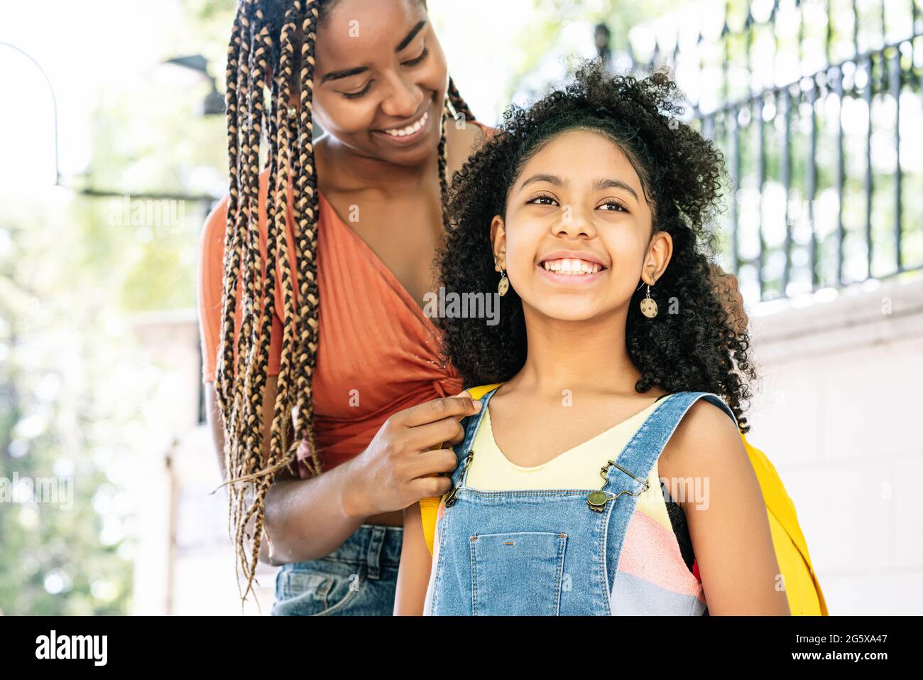 Mother taking her daughter to the school. Stock Photo