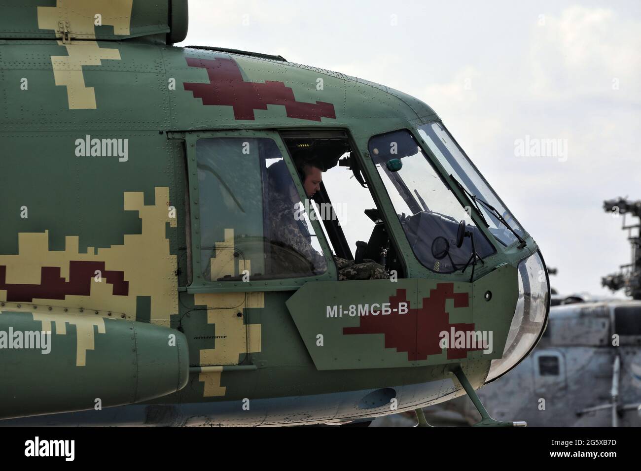 MYKOLAIV, UKRAINE - JUNE 30, 2021 - A pilot sits in the cockpit of a helicopter at the Kulbakyne aerodrome during the Exercise Sea Breeze 2021, Mykolaiv, southern Ukraine. Stock Photo