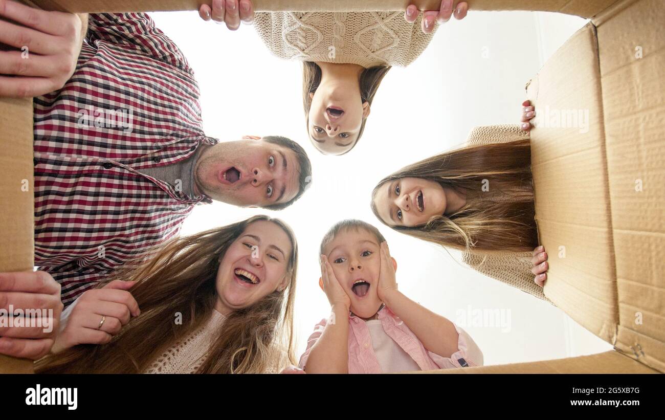 Big family with kids gets amazed or surprised after opening box and ...