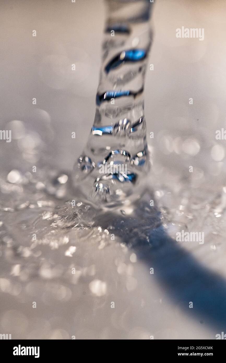 Water bubbles closeup. Tap water from a faucet. Extreme macro closeup