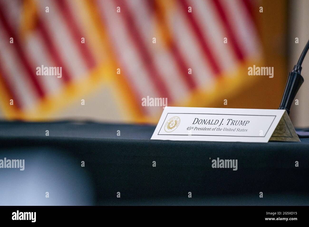 Weslaco Texas USA, June 30 2021: A placard with former President Donald Trump's name is shown ahead of a border security briefing. Texas Gov. Greg Abbott has pledged to build a state-funded border wall between Texas and Mexico as a surge of mostly Central American immigrants crossing into the United States has challenged U.S. immigration agencies. So far in 2021, U.S. Border Patrol agents have apprehended more than 900,000 immigrants crossing into the United States on the southern border. (Brandon Bell/POOL) Credit Bob Daemmrich/Alamy Live News Stock Photo