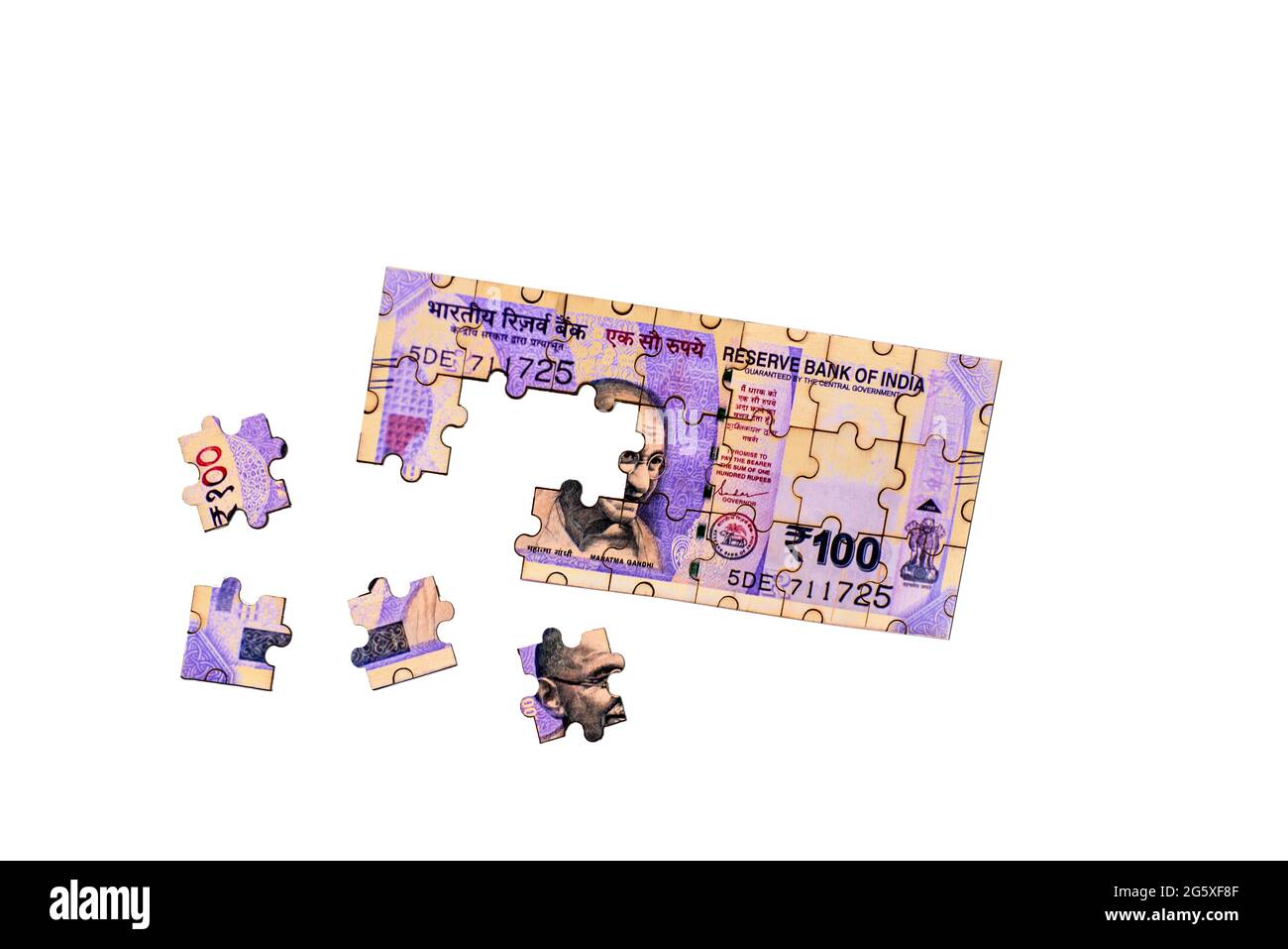 One Hundred Indian currency puzzle with four pieces moved on isolated