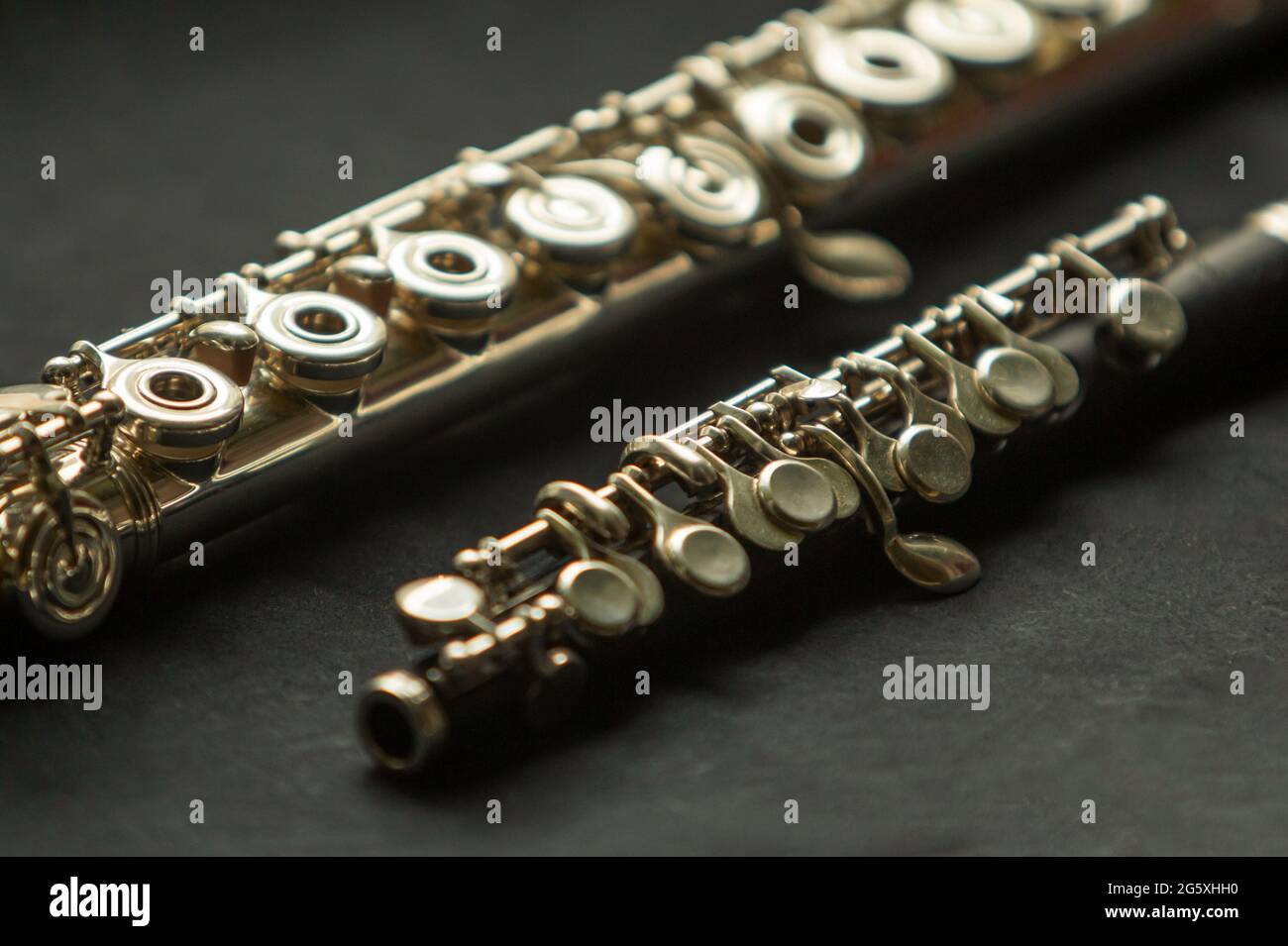 Musical wind instrument piccolo flute and brass flute Stock Photo