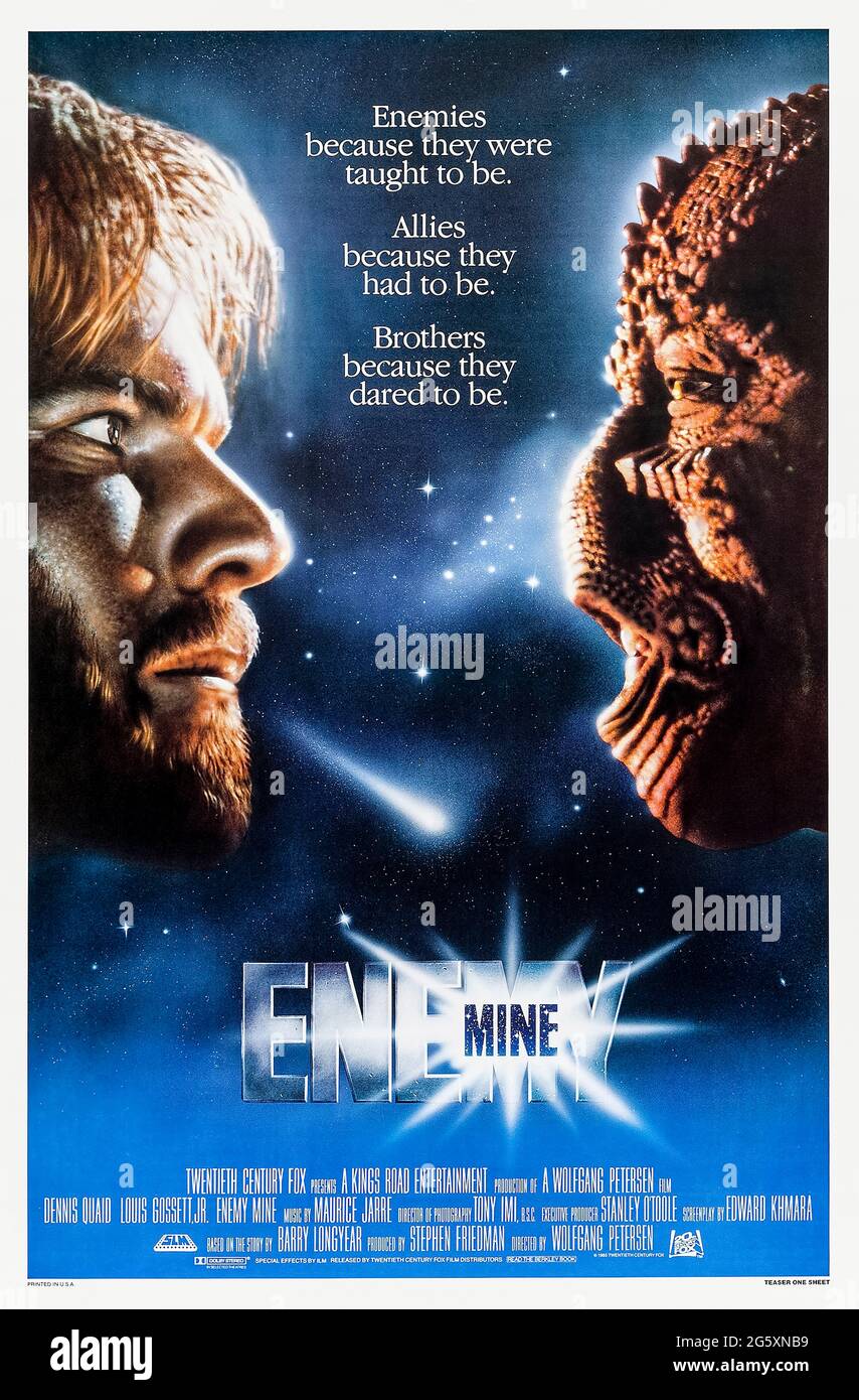 Enemy Mine (1985) directed by Wolfgang Petersen and starring Dennis Quaid, Louis Gossett Jr. and Brion James. An alien and human put their rivalry aside to survive on an alien world on which they are both marooned during a space battle. Stock Photo