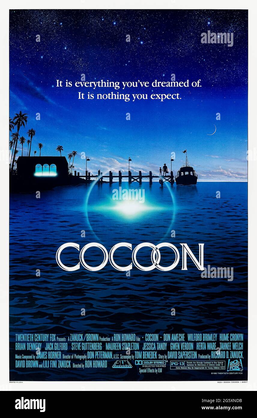 Cocoon (1985) directed by Ron Howard and starring Don Ameche, Wilford Brimley, Hume Cronyn and Steve Guttenberg. Heartwarming comedy about a group of residents from a retirement home who swim in a pool containing alien cocoons and find themselves rejuvenated with youthful energy. Stock Photo
