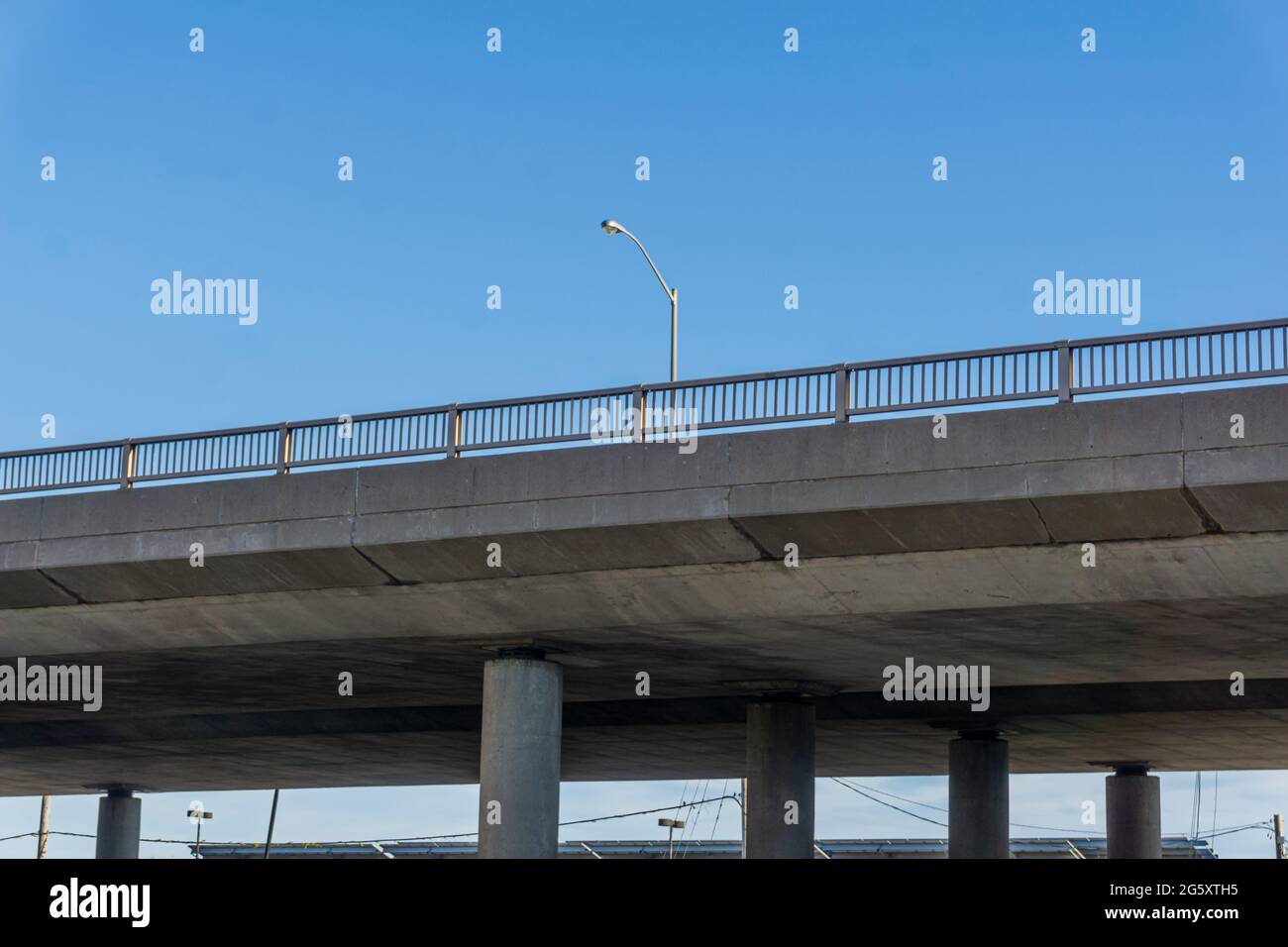 View from below of a flyover road suspended on concrete pillars Stock Photo