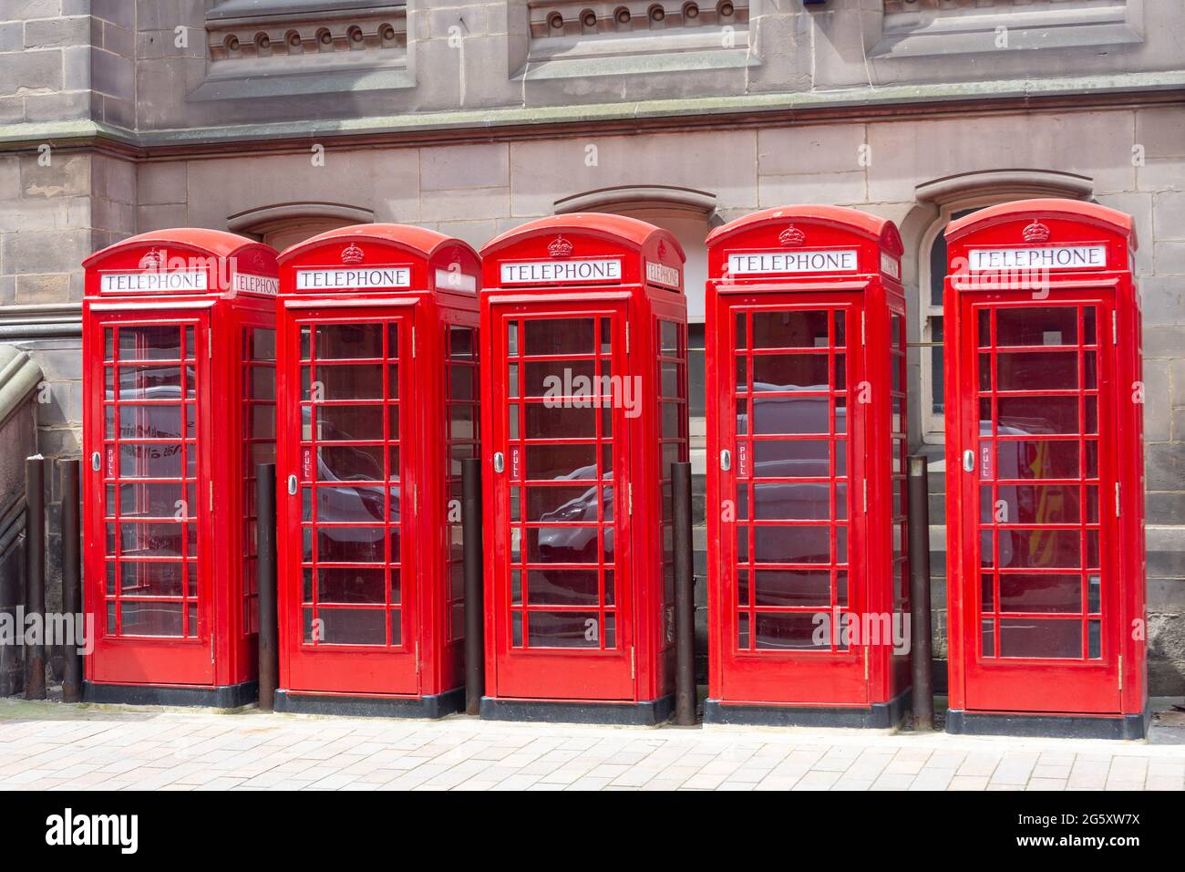 Row of red telephone boxes, Dunning Street, Middlesbrough, North Yorkshire, England, United Kingdom Stock Photo