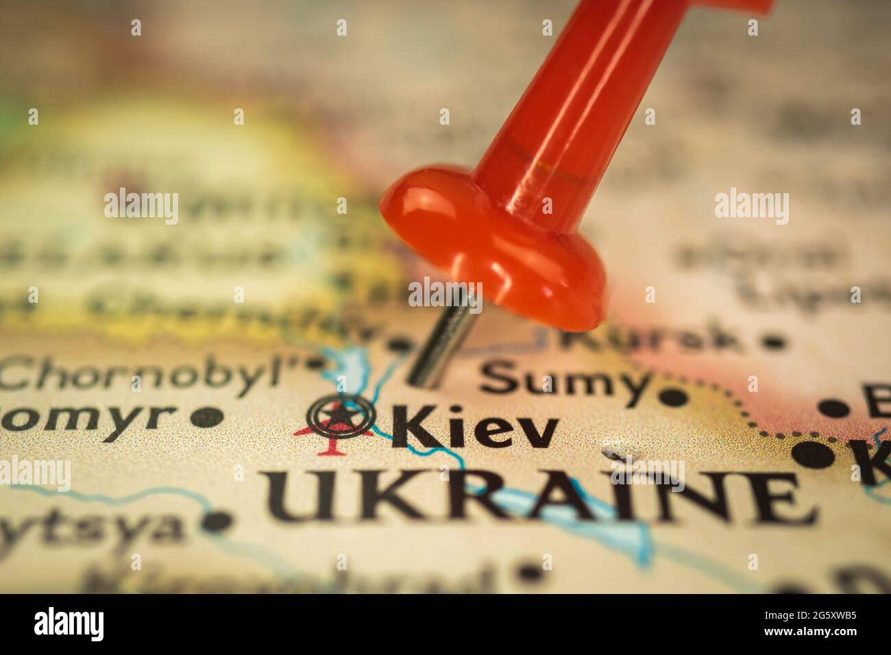 Location Kiev in Ukraine, push pin on map closeup, marker of destination for travel, tourism and trip concept, Europe Stock Photo