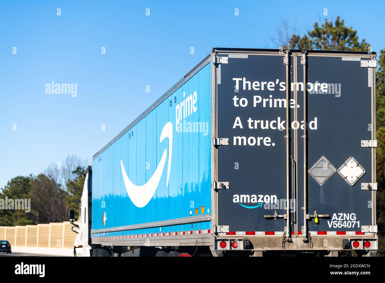 Richmond, USA - March 5, 2021: Highway road in Virginia with Amazon prime shipping delivery truck vehicle with blue Prime logo sign text Stock Photo