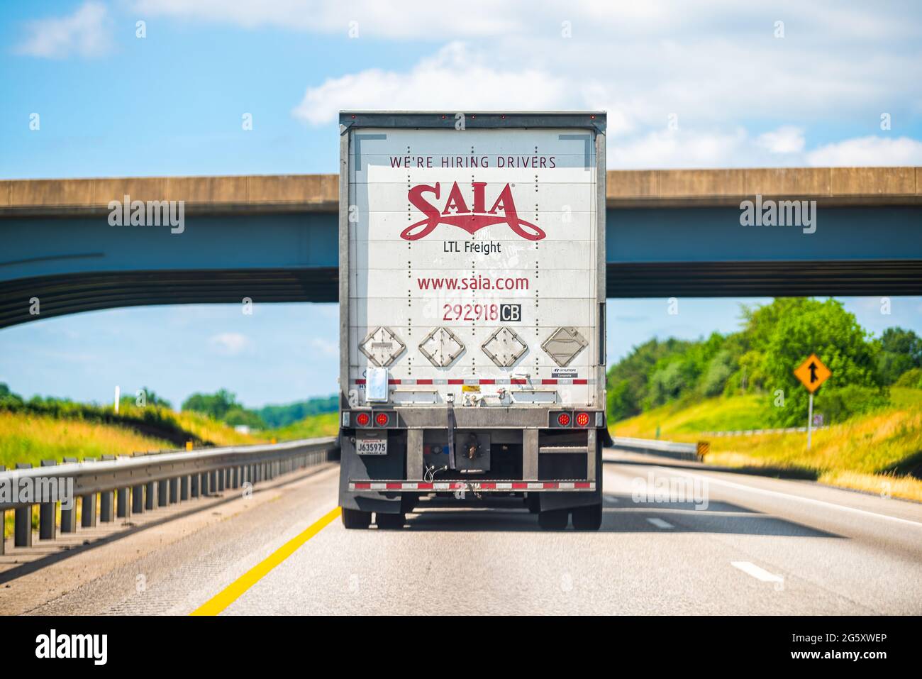 Lexington, USA - May 27, 2021: Highway road in Virginia with truck vehicle for Saia transport and sign for hiring drivers application on online websit Stock Photo