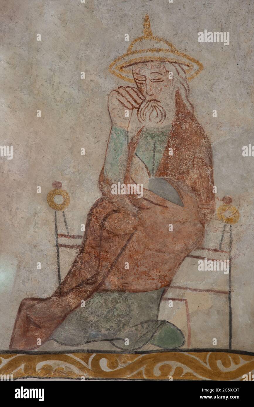 Saint Joseph, the husband of Mary, in a jewish hat, sitting in a chair, an ancient mural in Skibby church in Denmark, June 28, 2021 Stock Photo