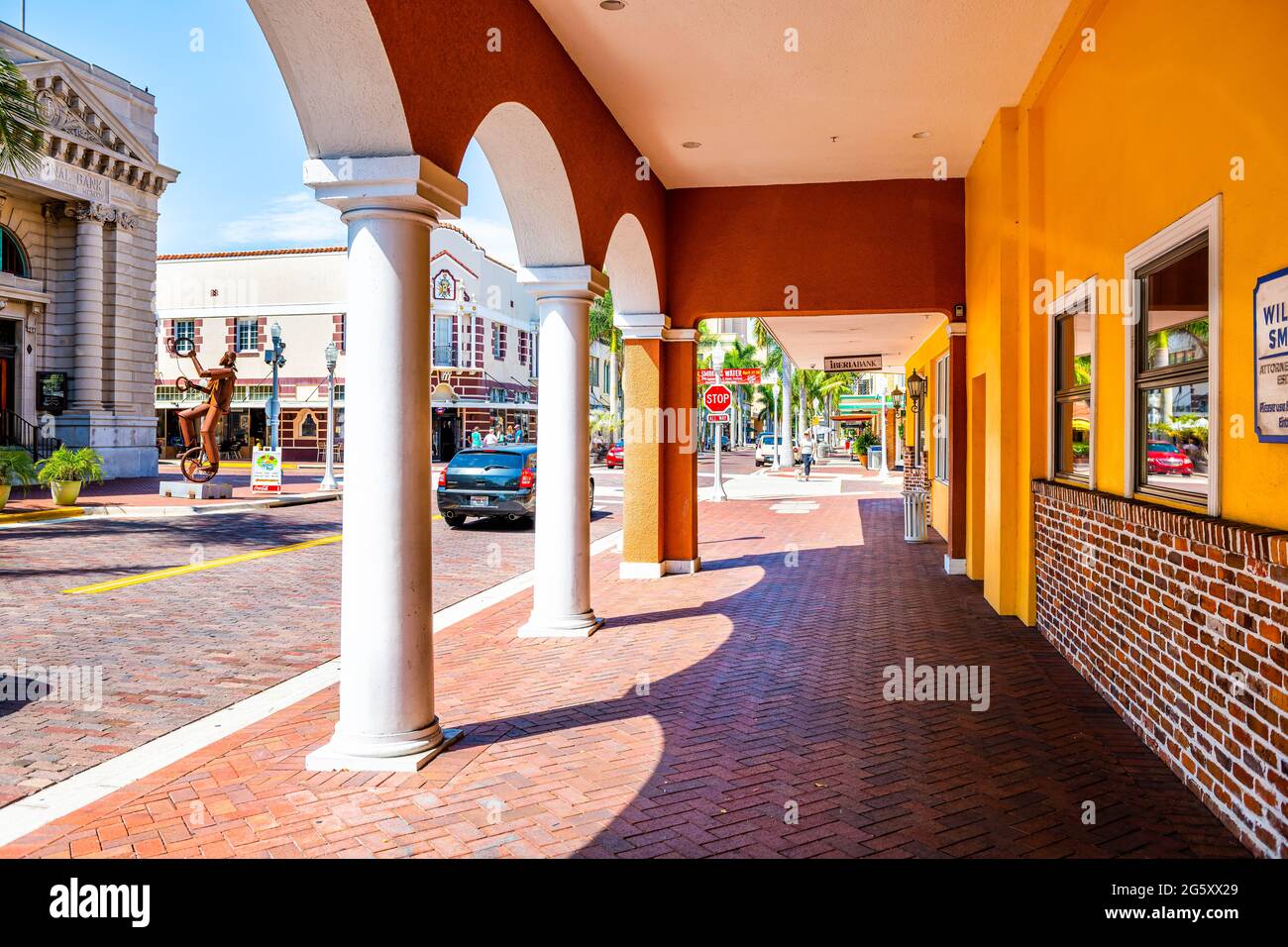 Fort Myers, USA - April 29, 2018: City street during sunny day in Florida gulf of mexico coast with shopping, restaurants and bank from sidewalk pavem Stock Photo
