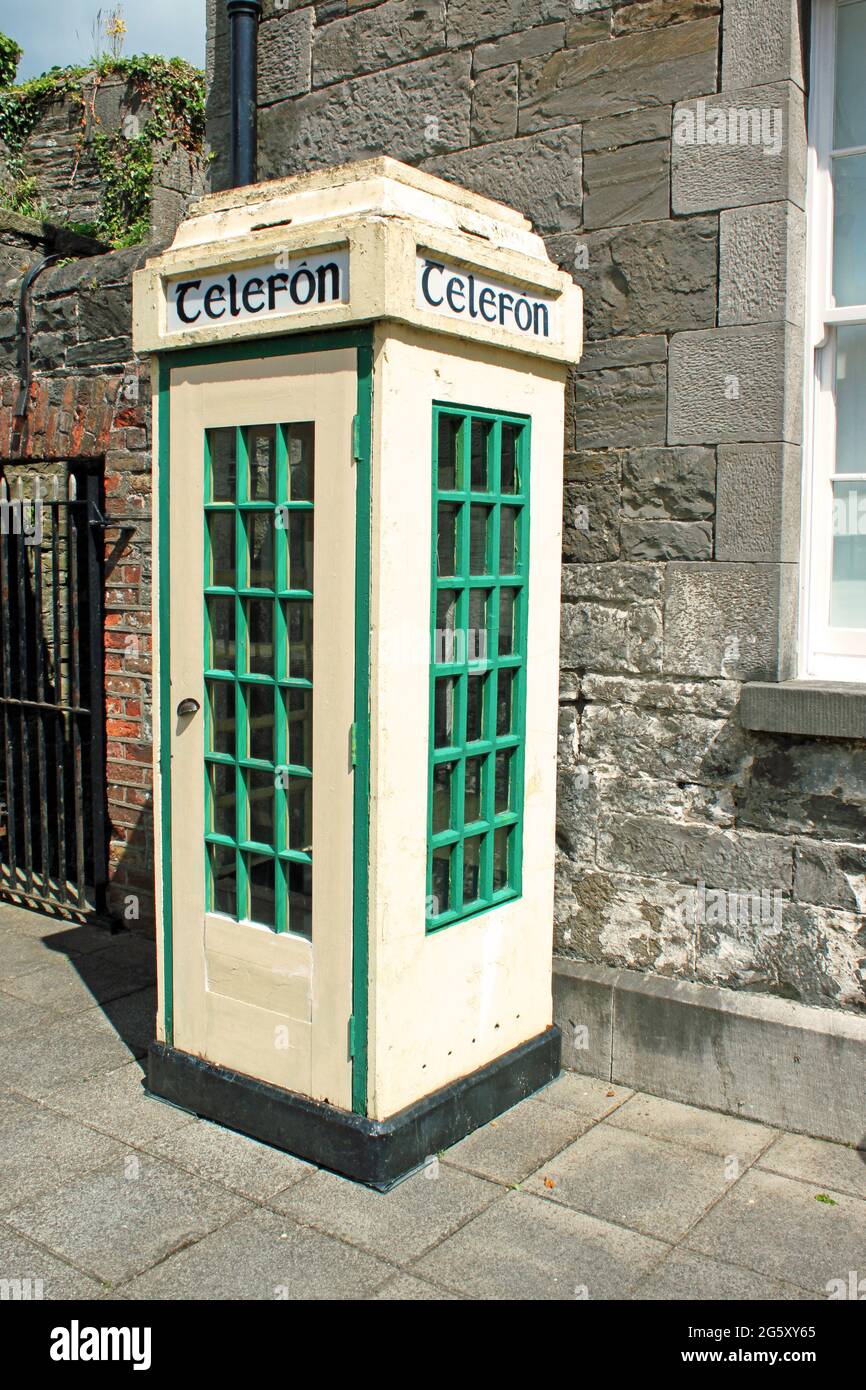 Vintage Irish telephone box in its original colours. Stock Photo