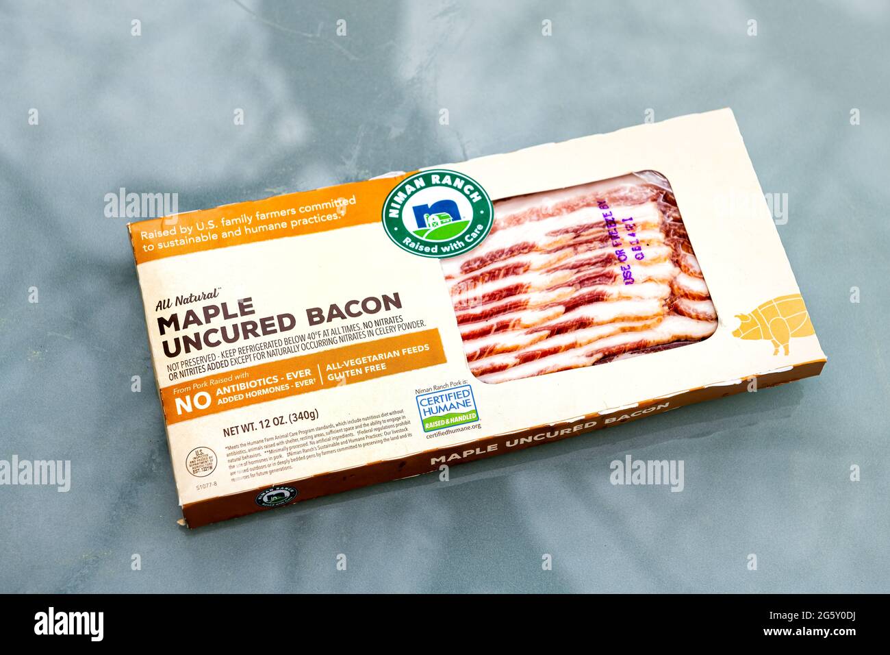 Nellysford, USA - April 29, 2021: Raw uncured maple bacon meat vacuum sealed label sign text packaged by Niman Ranch with humane practices Stock Photo