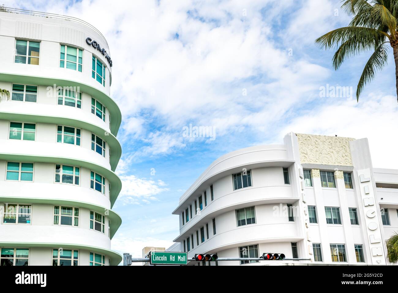 Miami Beach, USA - January 17, 2021: Lincoln road famous shopping street with sign for Compass real estate and theater art deco architecture and nobod Stock Photo