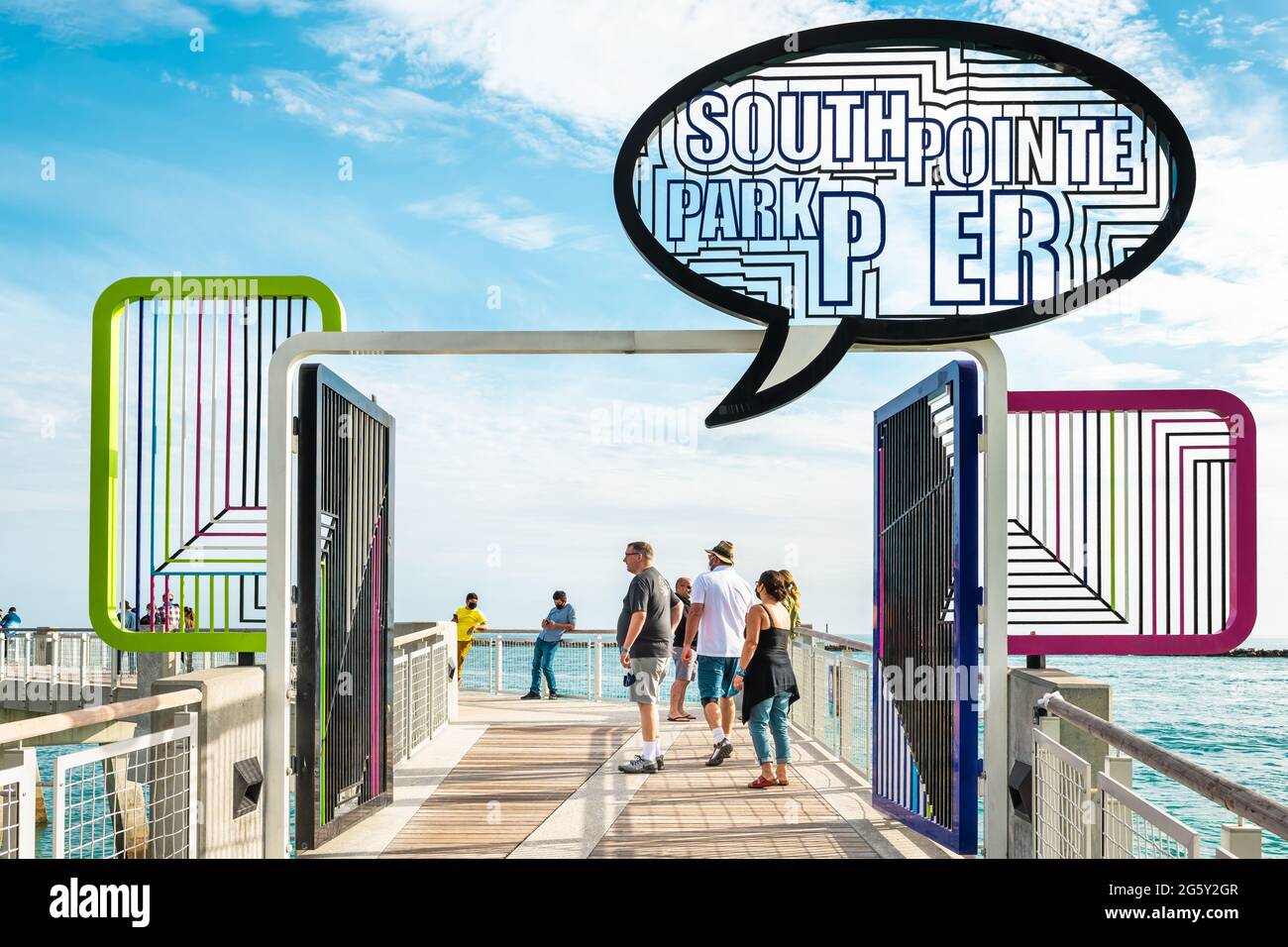 Miami Beach, USA - January 17, 2021: South beach Lummus Park promenade and sign entrance for south pointe park pier on south end of Miami beach Stock Photo