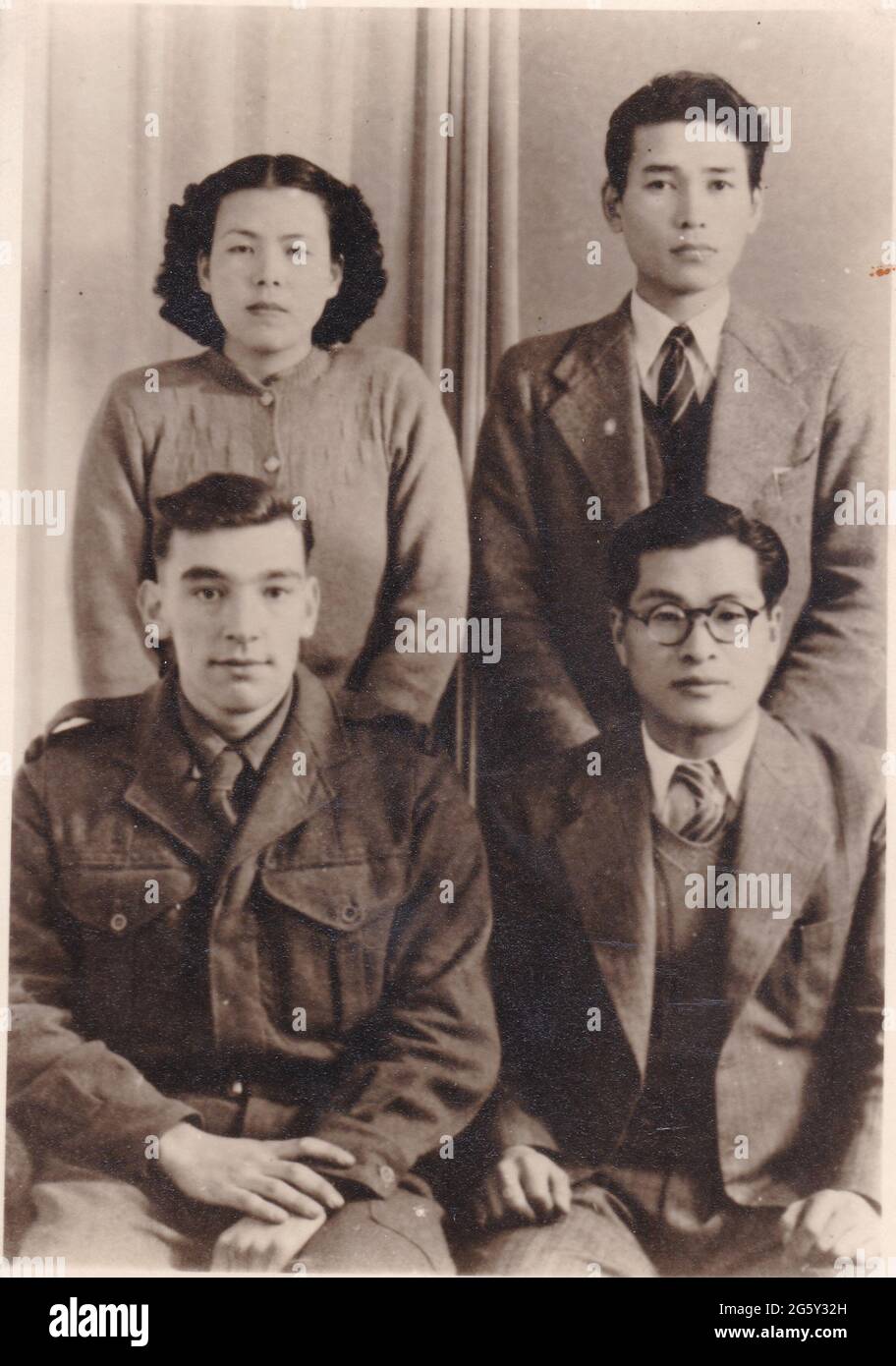 Vintage black and white photo of young people, possibly Oriental  1940s. Stock Photo