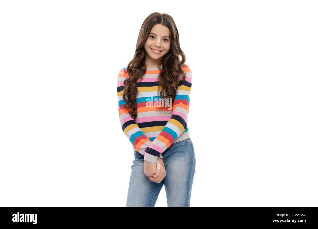 Happy teen girl smile in striped sweater isolated on white, teenage fashion Stock Photo