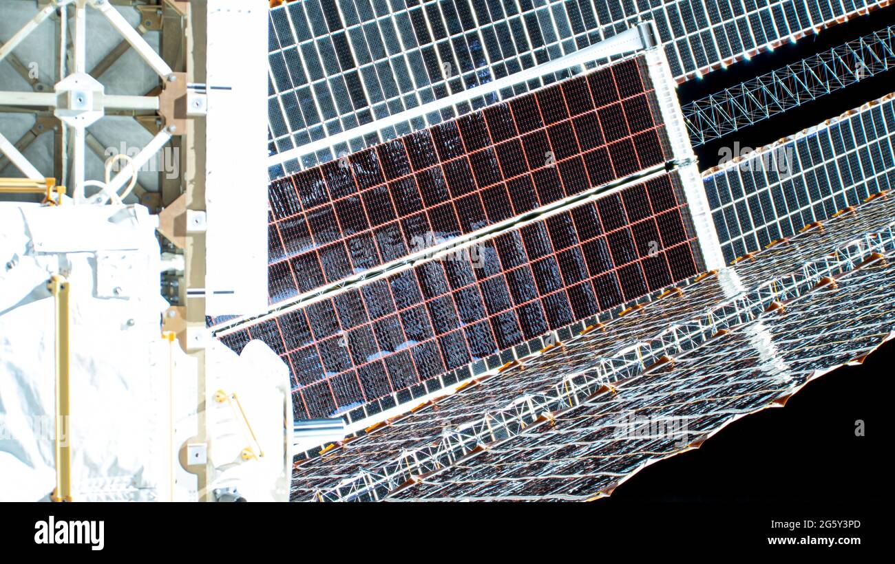 The second roll out solar array on the International Space Station after installation by astronauts Thomas Pesquet of ESA and Shane Kimbrough of NASA June 25, 2021 in Earth Orbit. Stock Photo