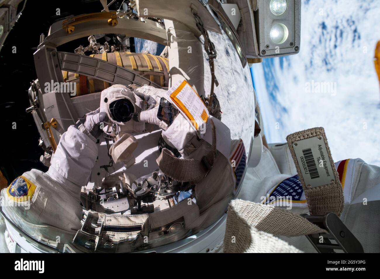 NASA astronaut Shane Kimbrough takes a selfie as he works on the installation of the second roll out solar array on the International Space Station June 25, 2021 in Earth Orbit. Stock Photo