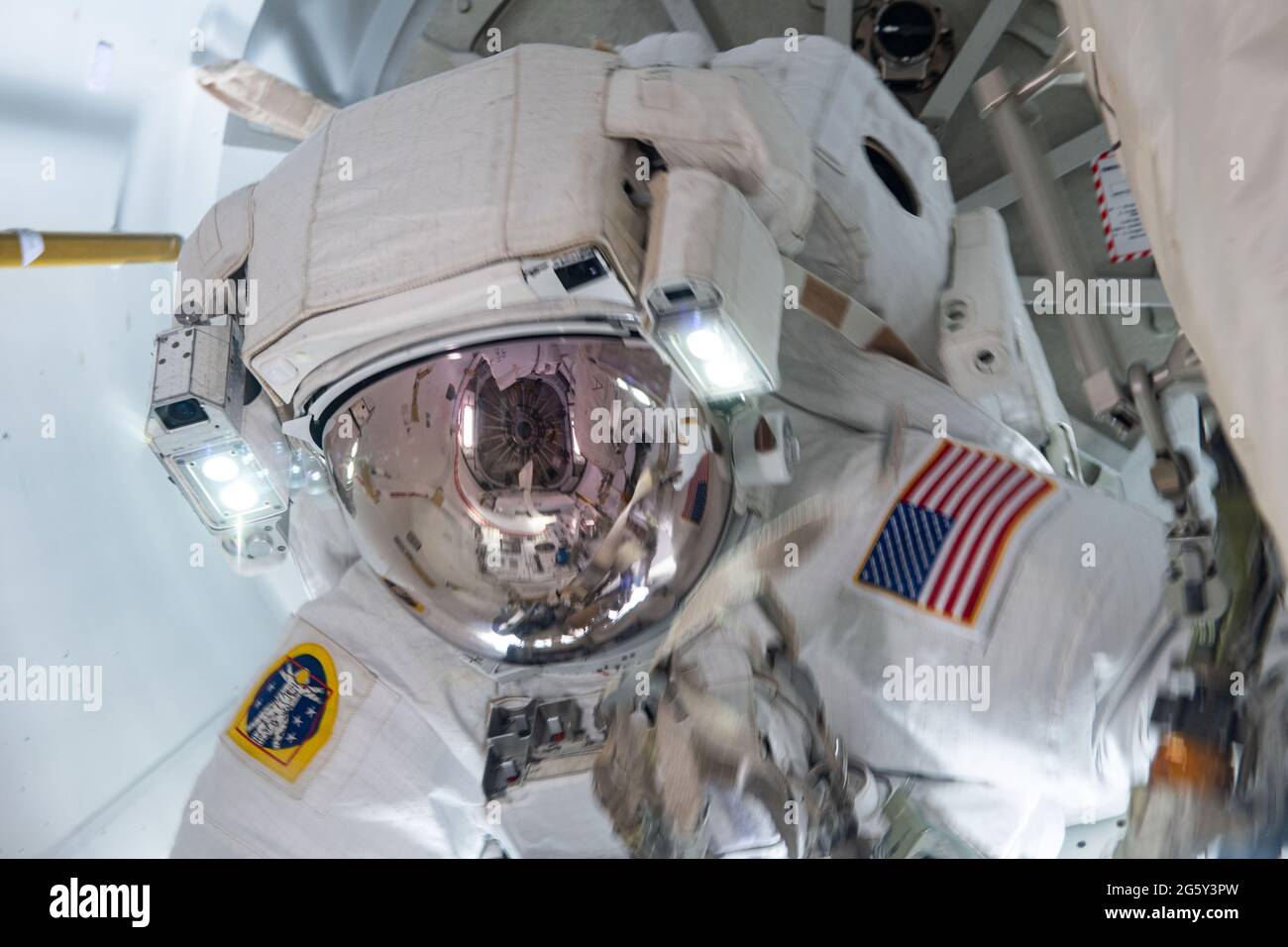NASA astronaut Shane Kimbrough in the Quest airlock after he and ESA astronaut Thomas Pesquet, completed the installation of the second roll out solar array on the International Space Station June 25, 2021 in Earth Orbit. Stock Photo