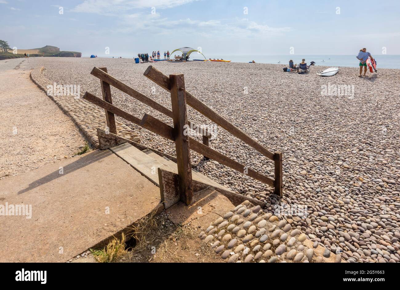 Wooden steps leading down to the pebble beach in Budleigh Salterton, an