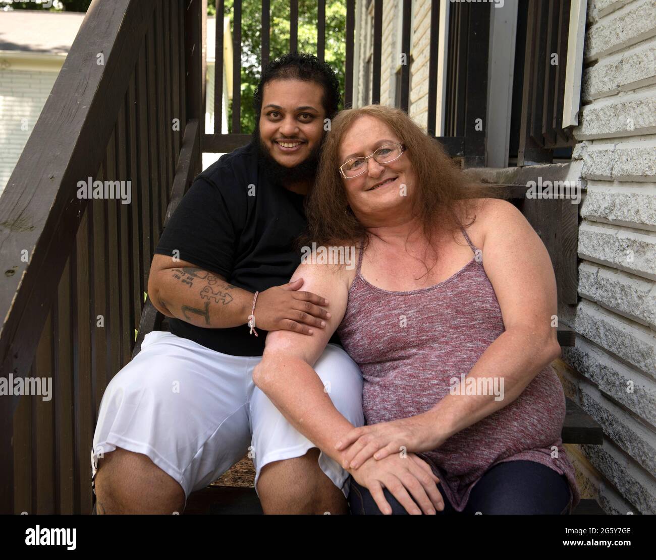 Conley, Georgia, USA. 29th June, 2021. JAMIL-JACK ABREAU and wife LUPA BRANDT are a married transgender couple in Atlanta who direct the non-profit Phoenix Transition Program for transgender individuals coming out of incarceration. Abreau, 38, born in Miami, Florida from Afro-Cuban and Afro-Puerto Rican parents, transitioned from female to male when he was 17. His wife Lupa, 59, is a U.S. Army military intelligence officer and now lives in her true gender. She was in the prison system for 33 years. The couple help transgender and gender non-conforming prisoners leaving the prison system with C Stock Photo