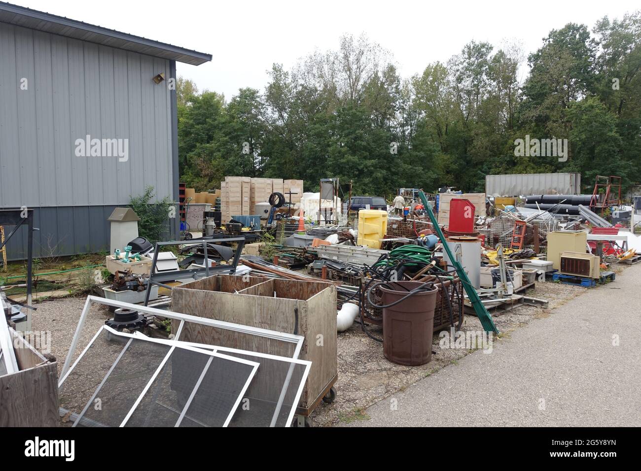 Bins of surplus scrap sit outside of Delaney's Surplus sales south of
