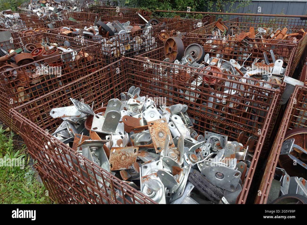 Bins of surplus scrap sit outside of Delaney's Surplus sales south of