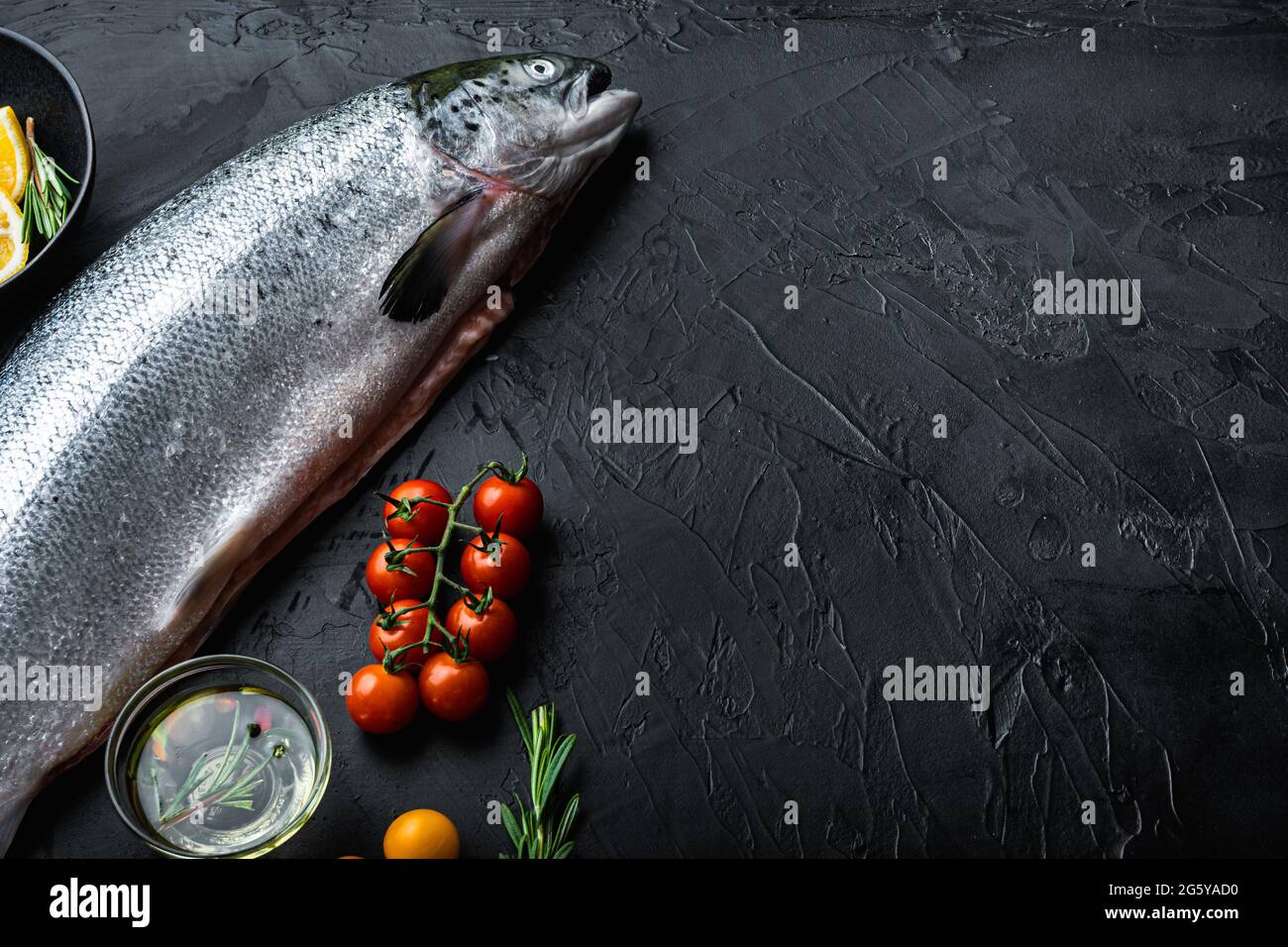 Fresh whole salmon on black background with space for text Stock Photo ...