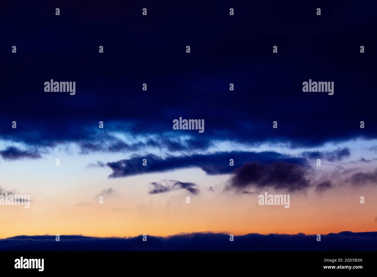 Dark blue clouds on the evening sky Stock Photo - Alamy