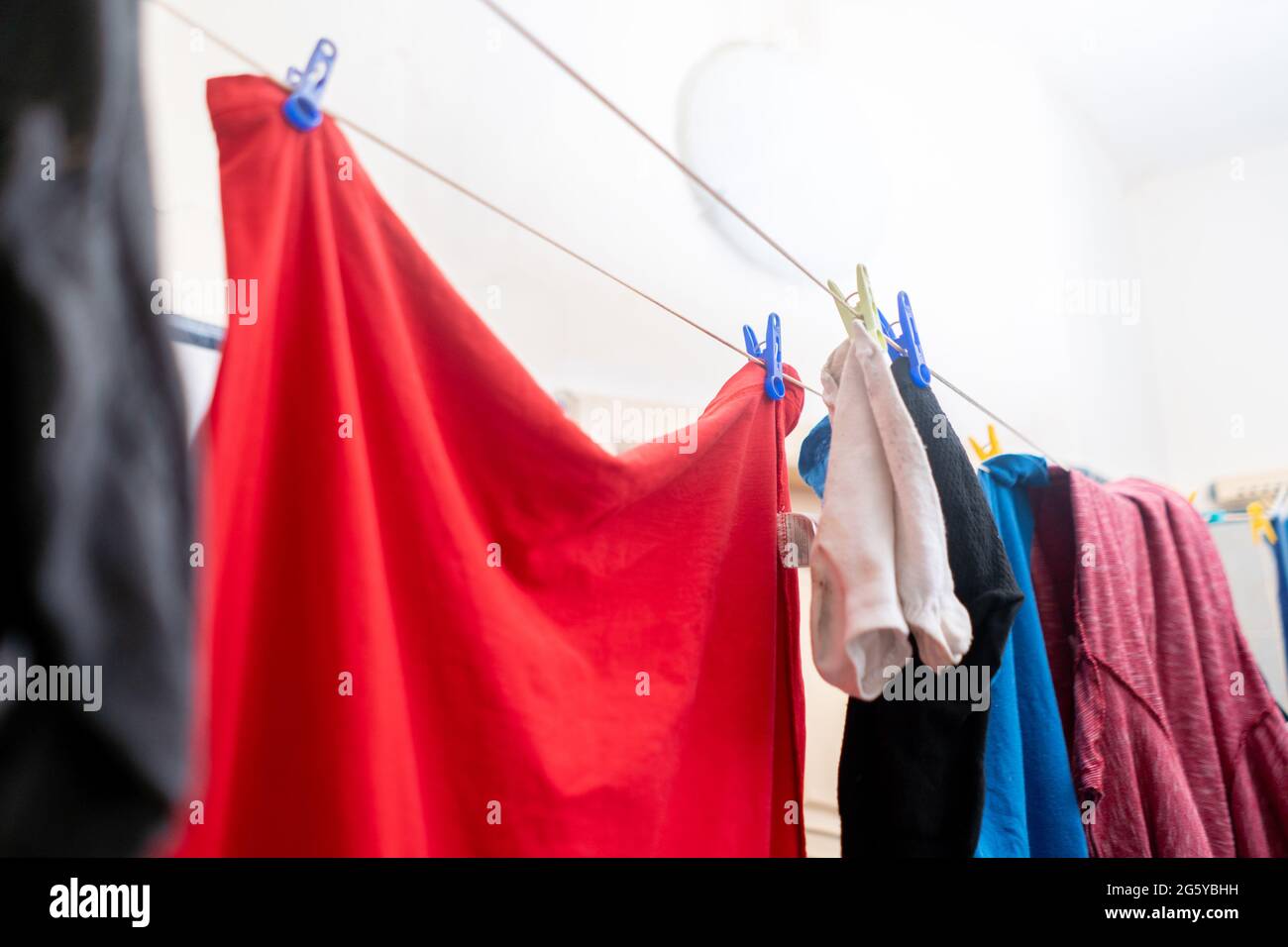 drying the clothes hanging in laundry, hanging after washing Stock
