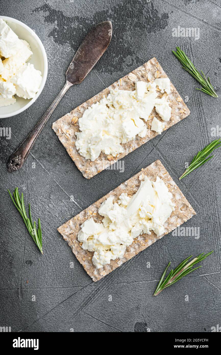 Crispbreads with feta set, on gray stone table background, top view ...