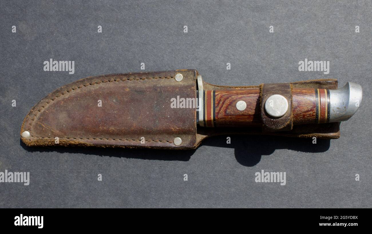 A Close Up of an Old Hunting Knife in a Leather Belt Case Stock Photo