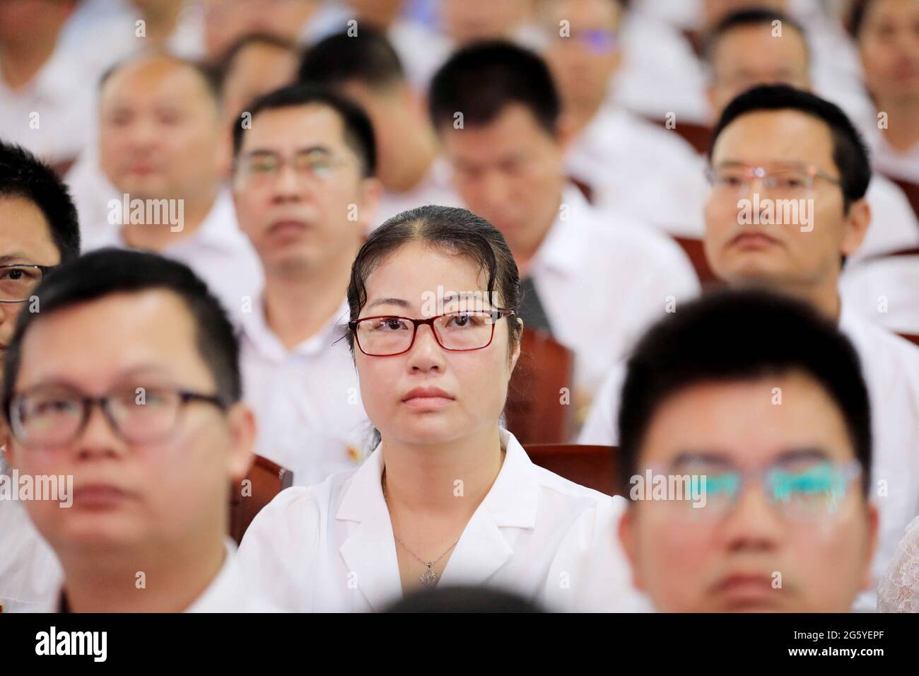 LIUZHOU, CHINA JULY 1, 2021 Party members watch a live broadcast of