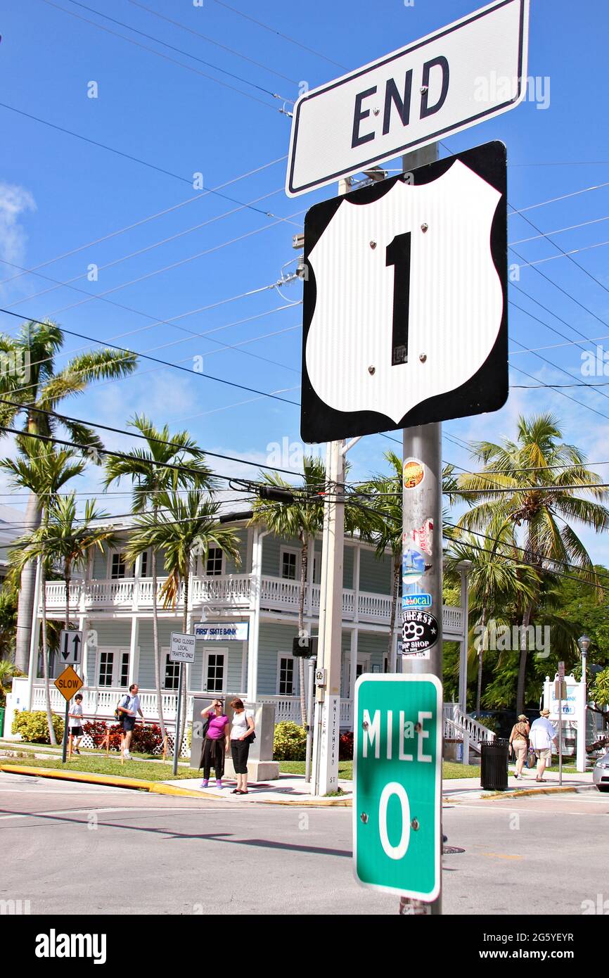 A sign for Mile 0 marks the end of Route 1 in Key West, Florida. Stock Photo