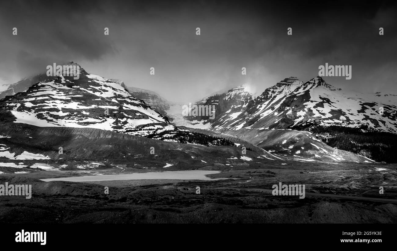Black and White Photo of the Snow Dome Glacier and surrounding mountains in the Columbia Icefields of Jasper National Park, Alberta, Canada Stock Photo