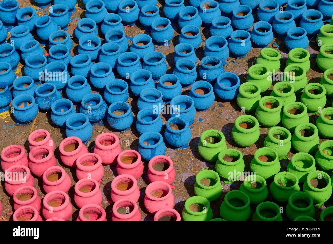 Pune, India - 30 Octo 2018, artist painting colors on terracotta pots, works of handicraft, for sale during Diwali Festival. Stock Photo