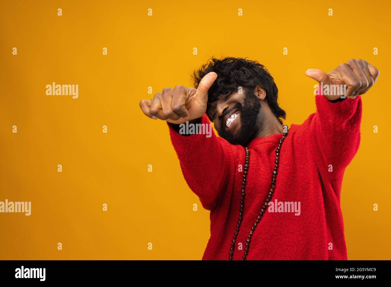 Happy young black man giving thumbs up Stock Photo - Alamy