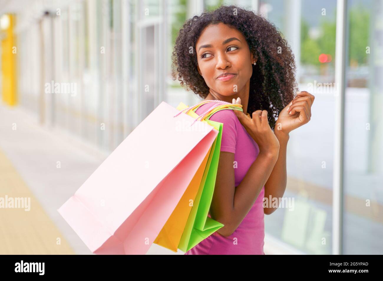 Portrait of one black woman shopping time in the street Stock Photo - Alamy
