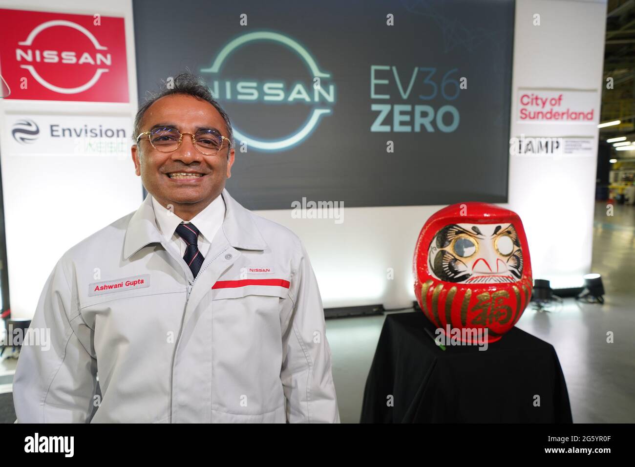 Nissan's Chief Operating Officer Ashwani Gupta stands next to a Daruma, a hollow, round, Japanese traditional doll regarded as a talisman of good luck, after announcing that the Japanese car giant is to build a new electric model and huge battery plant in the UK in a massive boost to the automotive industry. Picture date: Thursday July 1, 2021. More than 1,600 jobs will be created in Sunderland and an estimated 4,500 in supply companies under an investment of £1 billion. Stock Photo