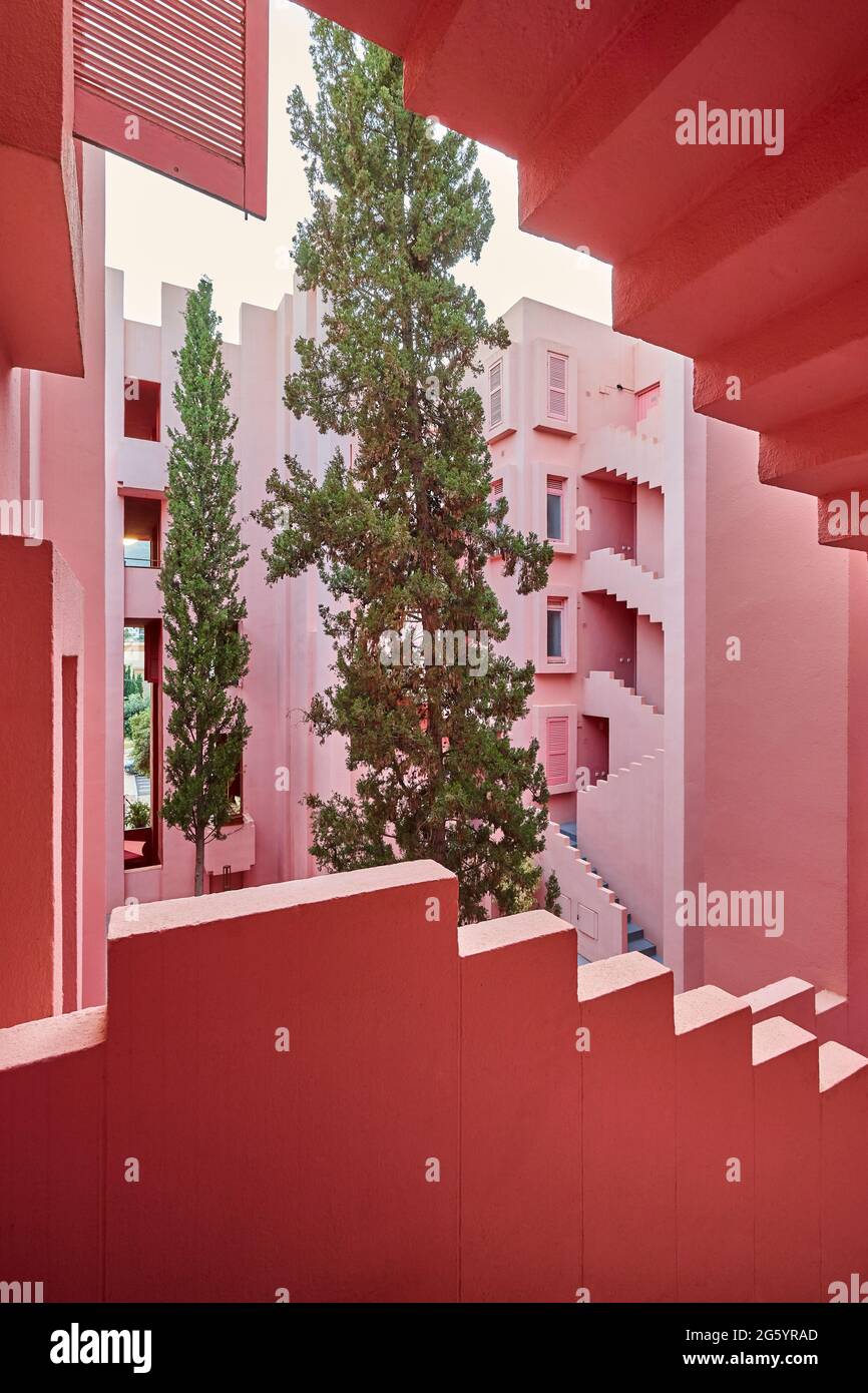 Geometric building construction. The red wall, La manzanera. Calpe, Spain Stock Photo