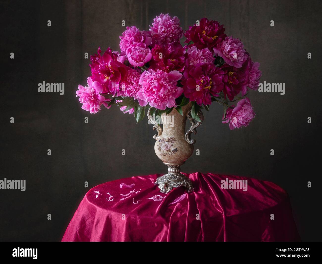 A bouquet of peonies in the interior of the living room Stock Photo