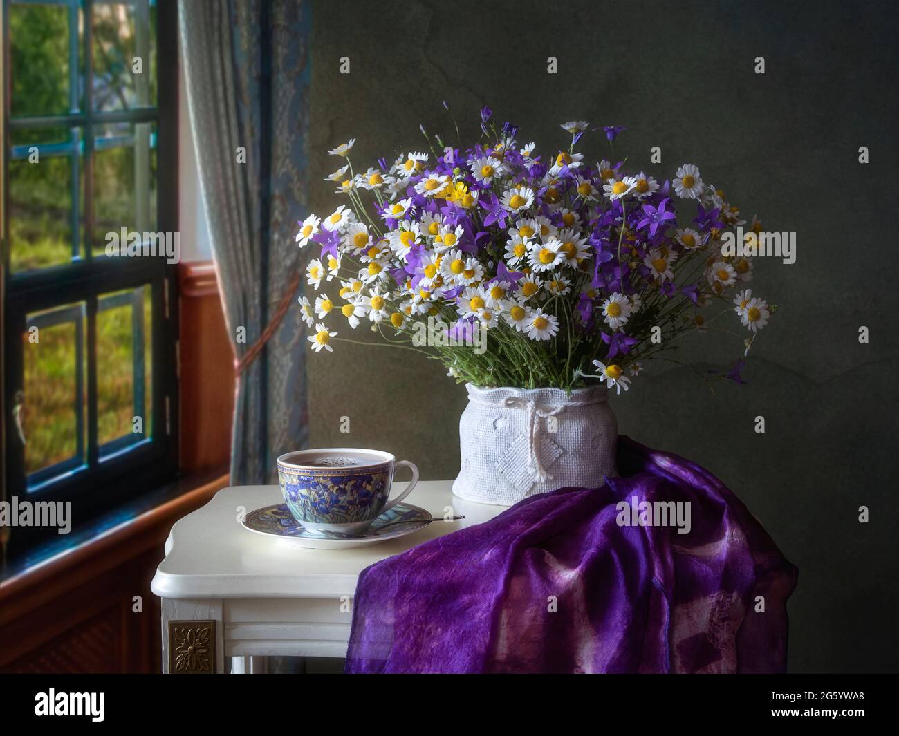 Still life with bouquet of wildflowers on a tea table Stock Photo - Alamy
