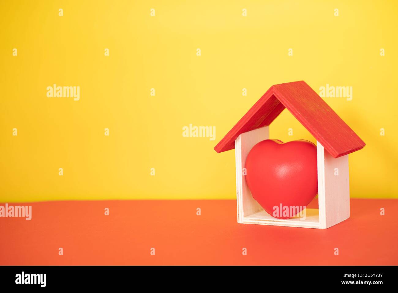 Layout depicting the proverb Home is where the heart is. Selective focus points. Blurred background Stock Photo